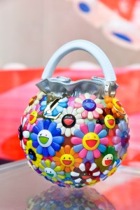 The Louis Vuitton stand at Art Basel Paris featuring artworks and handbag designs by Takashi Murakami.