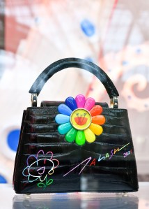 The Louis Vuitton stand at Art Basel Paris featuring artworks and handbag designs by Takashi Murakami.