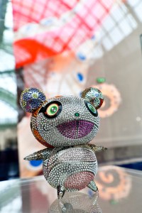 The Louis Vuitton stand at Art Basel Paris featuring artworks and handbag designs by Takashi Murakami.