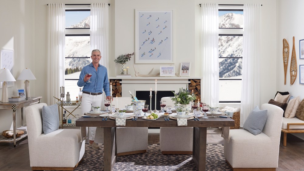 photographer gray malin standing in an ornately decorated dining room, filled with objects from his new MacKenzie-Childs collaboration