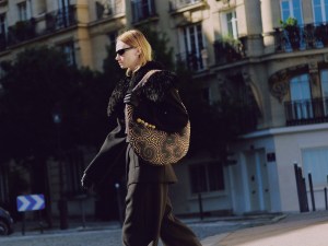 Schiaparelli calfskin Soufflé bag with studs, wool jacket and cowboy pants; Chimi sunglasses; Dior boots; Thomasine lambskin gloves.