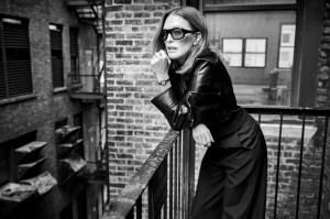 Givenchy by Sarah Burton wool cocoon jacket and trousers; Khaite shoes; Walter’s Faith 18-karat yellow gold and diamond earrings; Movado Heritage 1917 stainless steel watch with cherry leather strap.