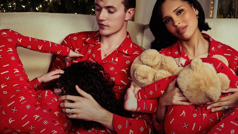 nara and lucky blue smith posing with their children while dressed in skims winter pajamas