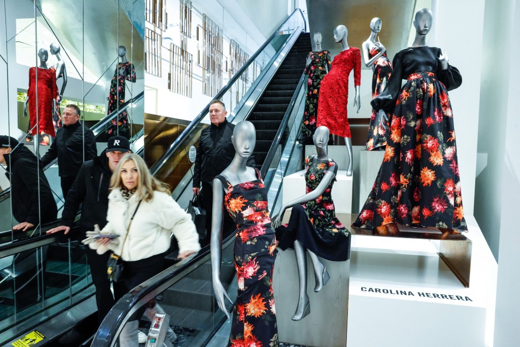 Costumers ride an escalator during Black Friday deals inside Saks Fifth Avenue Store in New York City, on November 28, 2025. A record $5 billion is expected to be spent per day over the 10 days that begins on "Black Friday" and runs through "Cyber Week."