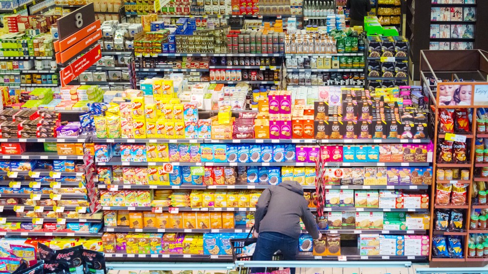 TORONTO, ONTARIO, CANADA - 2016/03/19: Canadian grocery store, person choosing products. Abundace of food is the number one reason for diabetis in the first world.