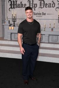 Austin Kiel at Netflix's "Wake Up Dead Man: A Knives Out Mystery" premiere held at the Academy Museum of Motion Pictures on November 17, 2025 in Los Angeles, California.