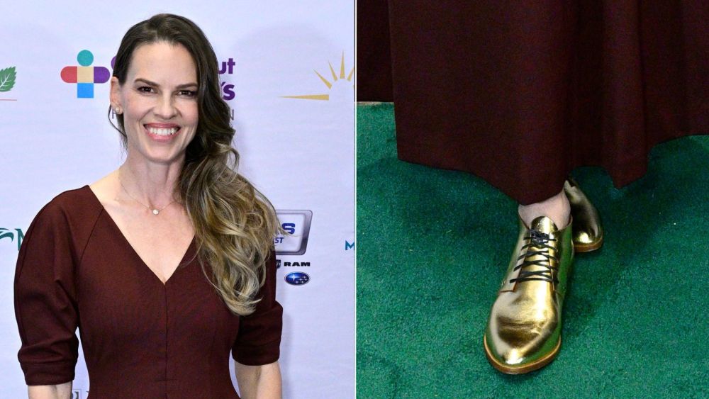 Hilary Swank wearing metallic gold oxfords, joining other celebrities like Amanda Seyfried, Julia Roberts and Katie Holmes in the menswear-inspired shoe trend.