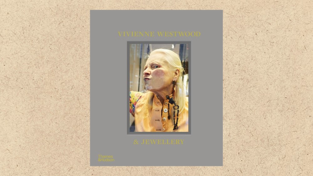 book on vivienne westwood's jewelry designs overlaid on a textured paper background in beige