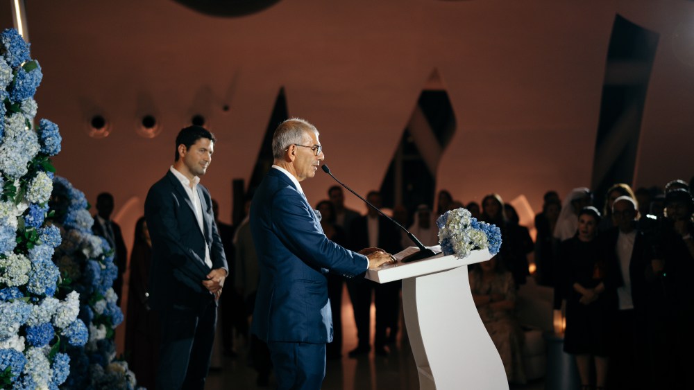 Patrick Chalhoub addresses guests at the group's 70th anniversary celebration as his son Michael looks on.