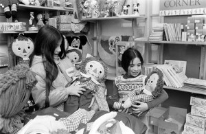Two young girls admire "Raggedy Ann and Andy" dolls at Macy's Herald Square, toy department.