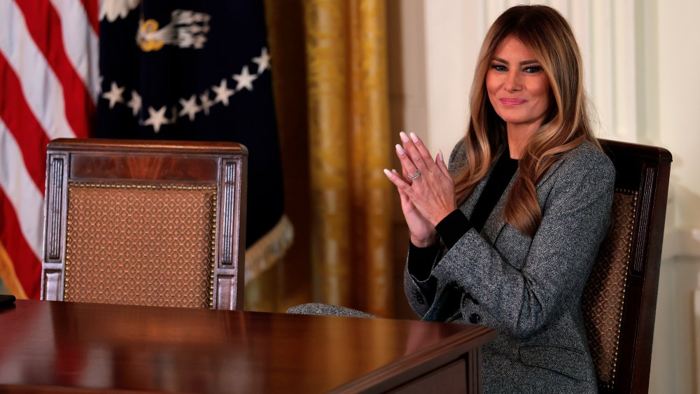 WASHINGTON, DC - NOVEMBER 13: First lady Melania Trump claps during an event for the signing of an executive order on the foster care system on November 13, 2025 in the East Room of the White House in Washington, DC. The Trump administration invited child welfare organizations, foster and adoptive families, and youth with experience in the foster care system to attend the event. (Photo by Heather Diehl/Getty Images)