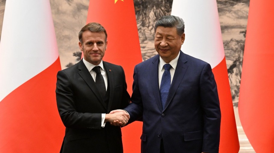 France’s President Emmanuel Macron and China’s President Xi Jinping shake hands after a joint press conference at the Great Hall of the People in Beijing on Dec. 4.
