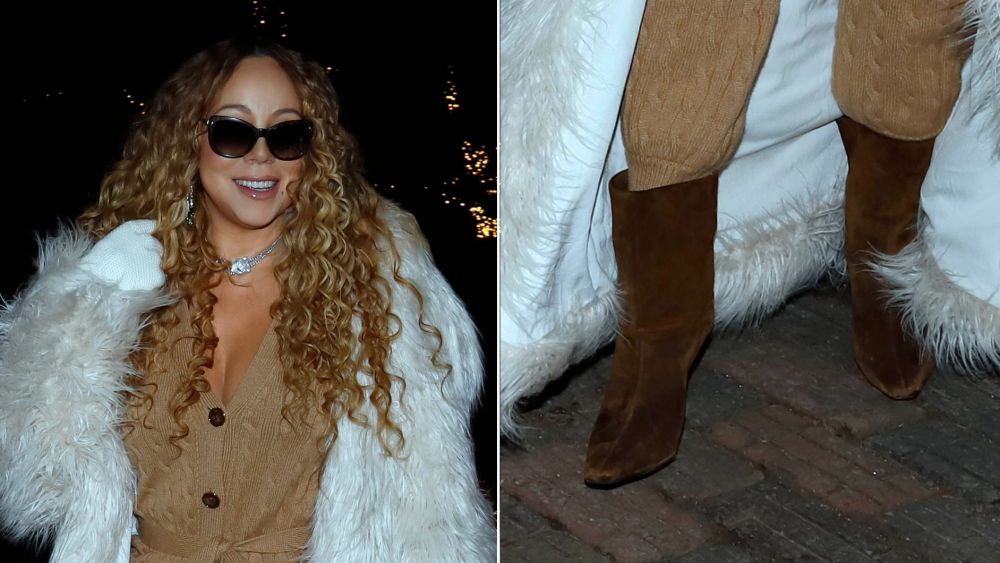Mariah Carey wears brown suede stiletto boots paired with a camel-hued cable knit set and a plush white coat in Aspen on Tuesday.