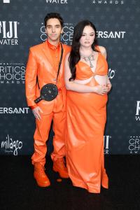 Paul W. Downs and Megan Stalter at the 31st Annual Critics Choice Awards held at Barker Hangar on January 04, 2026 in Santa Monica, California.