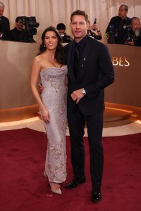 Juliana Herz and Justin Hartley at the 83rd Annual Golden Globes held at The Beverly Hilton on January 11, 2026 in Beverly Hills, California.