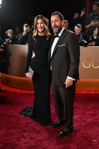Jackie Sandler and Adam Sandler at the 83rd Annual Golden Globes held at The Beverly Hilton on January 11, 2026 in Beverly Hills, California.