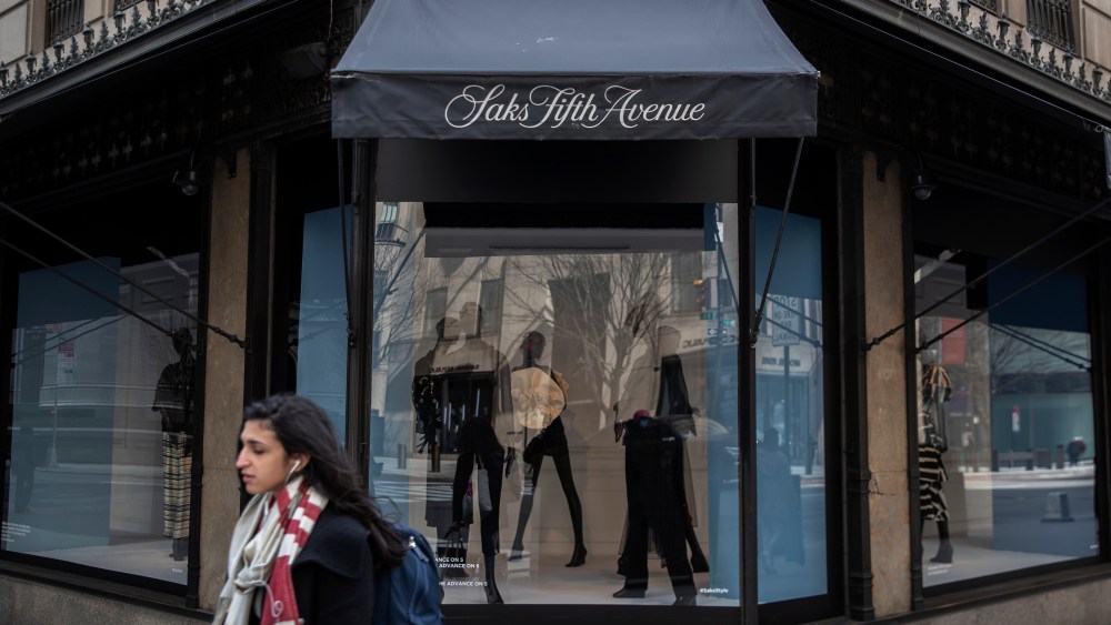 NEW YORK, NY - MARCH 18: Pedestrians pass by Saks Fifth Avenue Department store as it sits closed in the wake of the Coronavirus, COVID19, outbreak on March 18, 2020 in New York City. Businesses continued to close days after bars and restaurants shuttered as authorities in New York weighed a "shelter-in-place" order for the entire city. (Photo by Victor J. Blue/Getty Images)