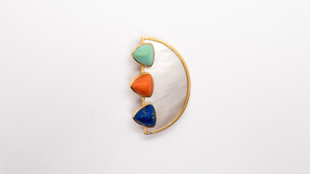 Brooch-Pendant “Aton Trio”. James Rivière, Italy 1986. 18k yellow gold, mother-of-pearl, lapis lazuli, coral, and turquoise. Historical Archive, James Rivière, Milan.