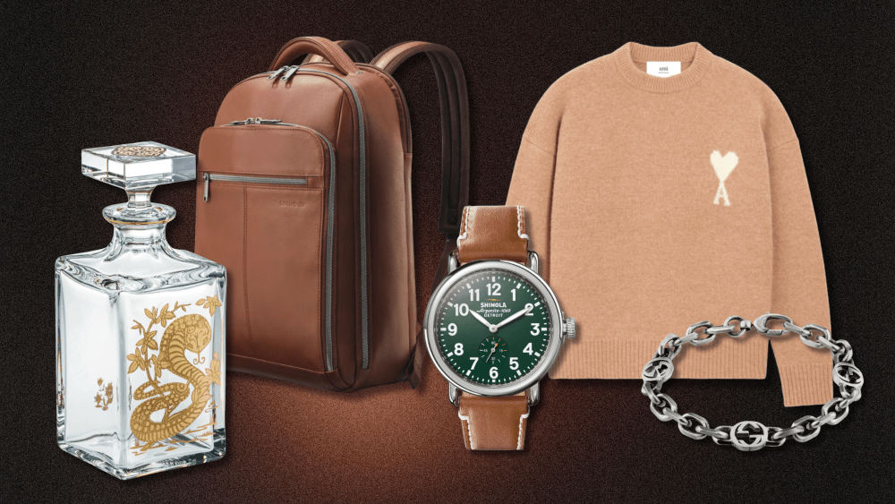roundup of gifts for men on valentine's day over gradient brown background, including luxury sweater, watch, backpack, bracelet, and decanter