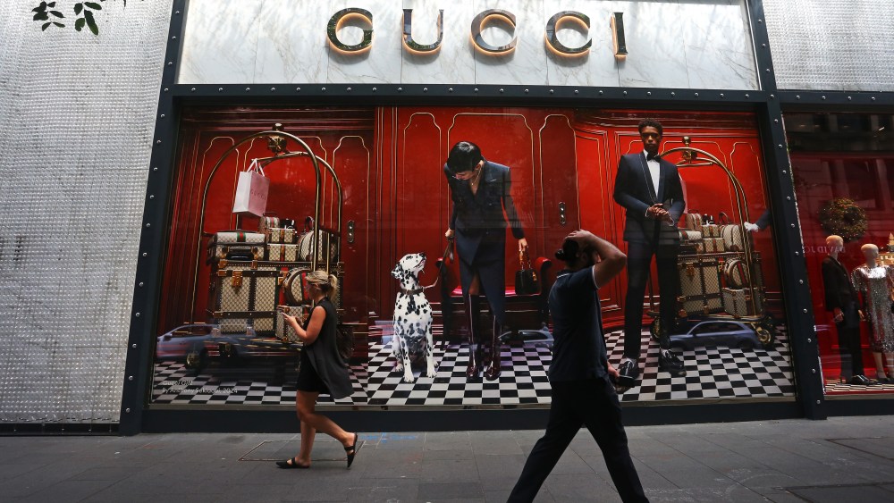 SYDNEY, AUSTRALIA - DECEMBER 06: Pedestrians walk by a Gucci store in the central business district (CBD) on December 06, 2024 in Sydney, Australia. Australia's economy grew by 0.3% in the September quarter of 2024, marking the twelfth consecutive quarter of growth but reflecting a slowdown from previous periods, with annual growth at 0.8%. The increase was primarily driven by public sector expenditure, although household spending remained flat amid persistent inflation and high borrowing costs, prompting concerns about the overall economic momentum. (Photo by Lisa Maree Williams/Getty Images)