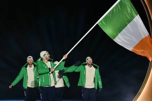 Ireland's flag bearer Thomas Maloney Westgaard and athletes parade during the opening ceremony of the Milano Cortina 2026 Winter Olympic Games.