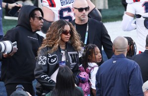Jay-Z with his daughters Blue Ivy Carter and  Rumi Carter attend Super Bowl LX between the New England Patriots and the Seattle Seahawks at Levi's Stadium in Santa Clara, California on February 8, 2026.