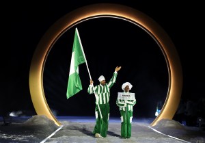 Flagbearer Samuel Uduigowme Ikpefan of Team Nigeria enters during the opening ceremony of the Milano Cortina 2026 Winter Olympics at Predazzo Ski Jumping Stadium on February 06, 2026 in Val di Fiemme, Italy.
