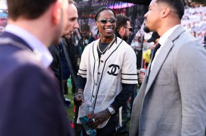 Rapper Travis Scott interacts with New England Patriots staff members prior to Super Bowl LX between the New England Patriots and the Seattle Seahawks at Levi's Stadium on February 08, 2026 in Santa Clara, California.