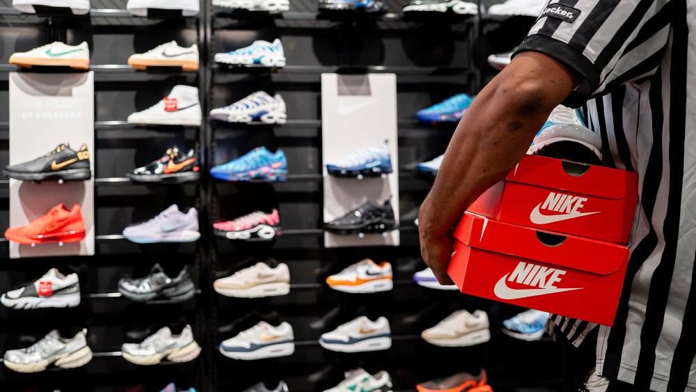 AUSTIN, TEXAS - AUGUST 28: An employee carries shoe boxes at the Footlocker retail store in the Barton Creek Square Mall on August 28, 2024 in Austin, Texas. The sneaker retailer reported growth in revenue by 1.9%, narrowly surpassing analysts expectations. (Photo by Brandon Bell/Getty Images)