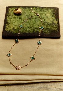 Louis Vuitton Fine Jewelry Color Blossom BB multimotif necklace in rose gold with malachite and diamonds; Beck Jewels pinky ring with diamond.