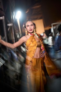 A model poses for pictures backstage after the Satya Paul show at Lakme Fashion Week 2026 on March 22, 2026 in Mumbai, India.