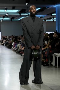 A model walks the runway wearing a look by ESMOD France student designer Nathan Vandenberghe and a handbag designed by ESMOD France student Alice Payet during LIM College's 81st Annual Fashion Show "Global Fashion Fusion" at The Glasshouse on April 10, 2026 in New York City.