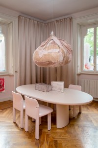In the main "pink room" she used patchwork offcuts to create a jovial imperfect spherical shape that can be hung from the ceiling. The curation includes Tacchini's new 1809 floor light, the Gianfranco Frattini Grand Sesann sofa and the Torii Love table by Studio Pepe finished in matte powder and pink lacquer.