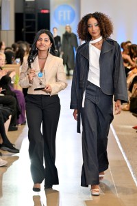 Designer Athmiha Saravanen and a model walk the runway during the FIT's 2026 Future of Fashion runway show on May 07, 2026 in New York City.