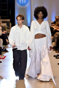 Designer Jonathan Marroquin and a model walk the runway during the FIT's 2026 Future of Fashion runway show on May 07, 2026 in New York City.