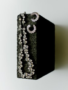 Swarovski rhodium-plated Constella necklace with crystals. Roberto Coin Cobra earrings in 18k-white gold with diamonds
