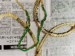 Suzanne Kalan tennis necklaces in 18-yellow gold, one with diamonds and one with emeralds