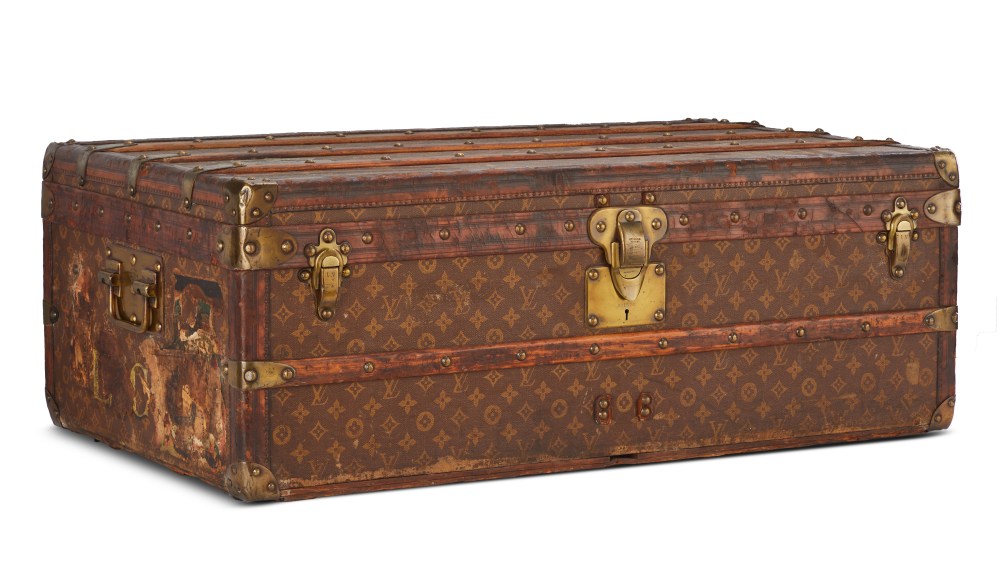 Louis Vuitton cabin trunk in Monogram canvas that once belonged to Louis Comfort Tiffany, 1907. Coated canvas, wood, leather, brass. Louis Vuitton collection.