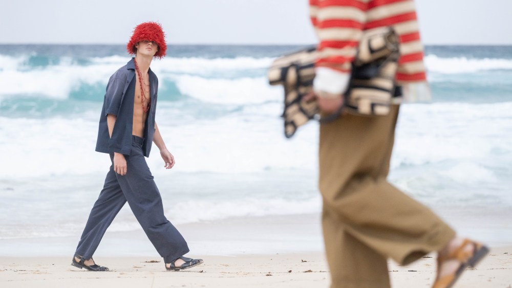 Two looks from Australian Fashion Week's viral Commas show at Tamarama Beach, Sydney, on May 12.