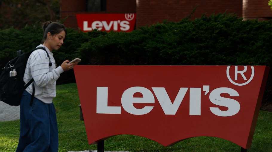 SAN FRANCISCO, CALIFORNIA - OCTOBER 09: A pedestrian walk by sign is posted in front of Levi Strauss headquarters on October 09, 2025 in San Francisco, California. Clothing maker Levi Strauss will report third-quarter earnings today after the closing bell. (Photo by Justin Sullivan/Getty Images)