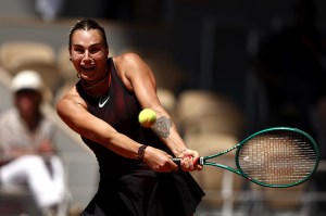 PARIS, FRANCE - MAY 26: Aryna Sabalenka plays a backhand against Jessica Bouzas Maneiro of Spain during the Women's Singles first round match during Day Three of the 2026 French Open at Roland Garros on May 26, 2026 in Paris, France. (Photo by James Fearn/Getty Images)