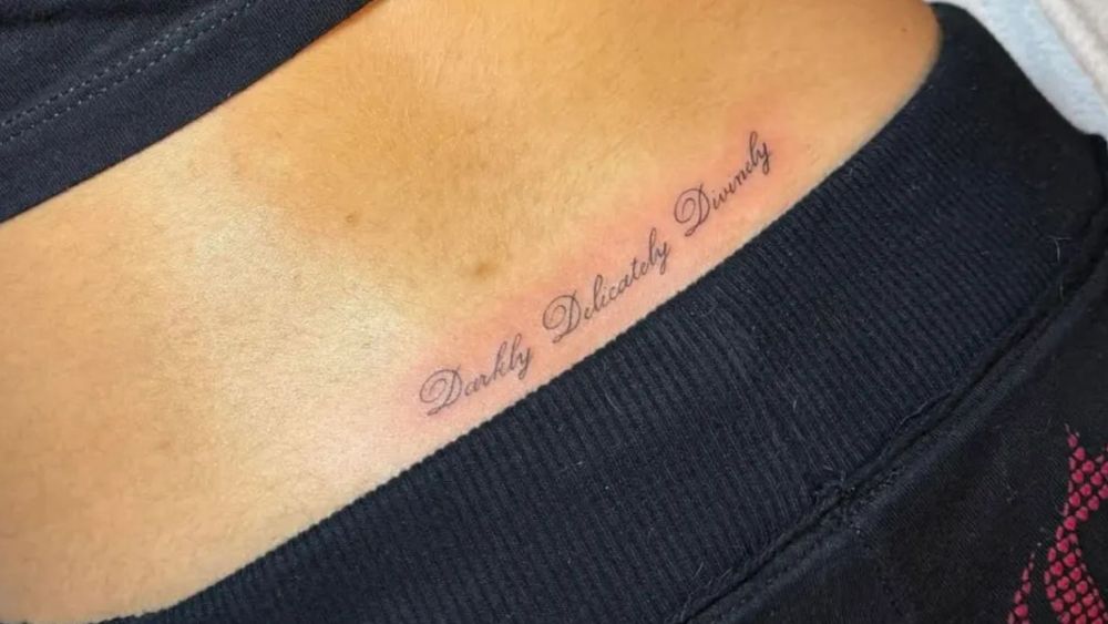Closeup of a lower back tattoo done by LA-based tattoo artist Milla Sofia Press.