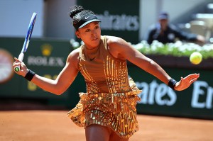 Japan's Naomi Osaka plays a forehand return to Germany's Laura Siegemund during their women's singles match on day 3 of the French Open tennis tournament on Court Suzanne-Lenglen at the Roland-Garros Complex in Paris on May 26, 2026. (Photo by Thomas SAMSON / AFP via Getty Images)