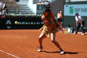 Japan's Naomi Osaka plays a backhand return to Germany's Laura Siegemund during their women's singles match on day 3 of the French Open tennis tournament on Court Suzanne-Lenglen at the Roland-Garros Complex in Paris on May 26, 2026. (Photo by Thomas SAMSON / AFP via Getty Images)