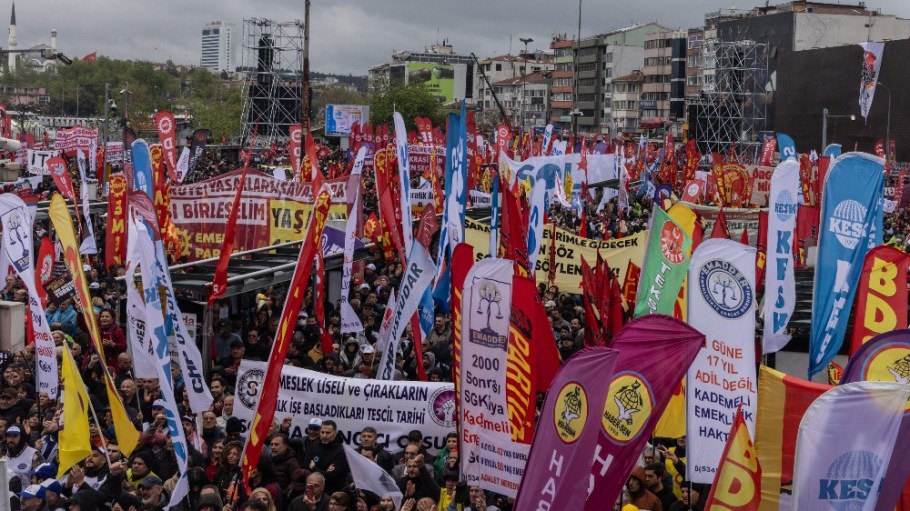 Protestors chant slogans and wave flags as, union workers, activist groups and members of political parties take part in a May Day demonstration march in the Kadikoy neighbourhood on May 01, 2025 in Istanbul, Turkey.