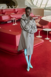 Maison Margiela cotton trenchcoat with spiral lapel, silk dress with tape details, cupro leggings, leather pumps and brass cluster drop earrings.