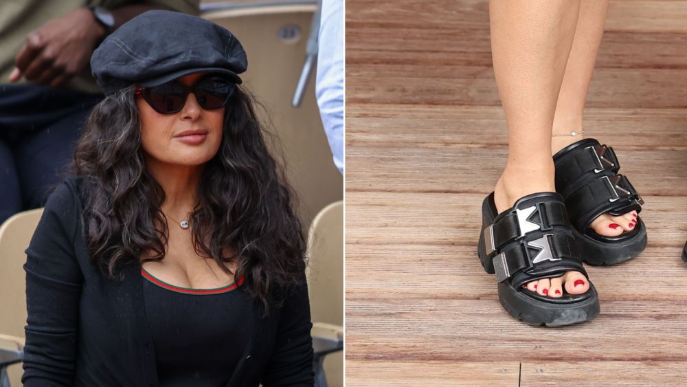 Salma Hayek Pinault wearing a pair of Bottega Veneta Flash Sandals in Black, a buckle-adorned silhouette, alongside her husband François-Henri Pinault at Day Eight of the French Open on Sunday.